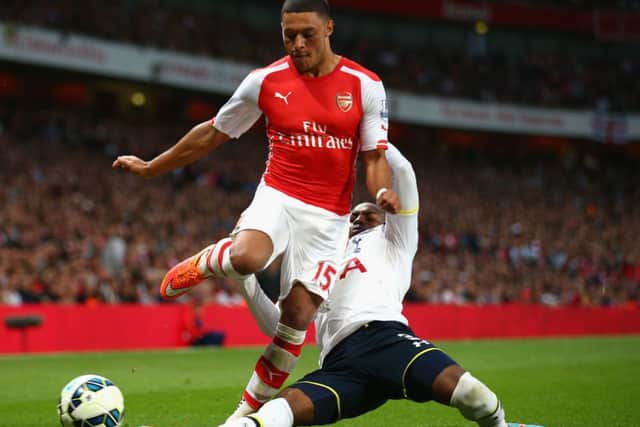 Danny Rose of Spurs tackles Alex Oxlade-Chamberlain. Picture: Getty