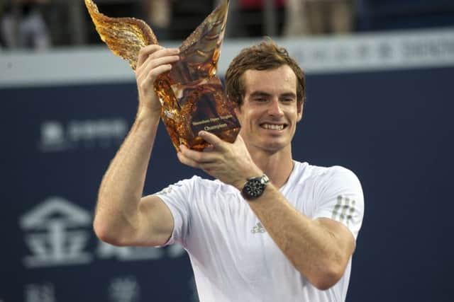 Andy Murray poses with his trophy during the award ceremony after winning the final match against Spain's Tommy Robredo at the Shenzhen Open. Picture: AP