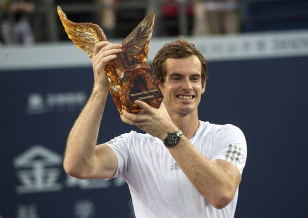 Andy Murray poses with his trophy during the award ceremony after winning the final match against Spain's Tommy Robredo at the Shenzhen Open. Picture: AP