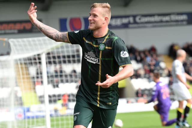 John Guidetti celebrates after putting Celtic 2-1 ahead against St Mirren on Saturday. Picture: SNS