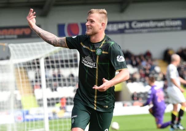 John Guidetti celebrates after putting Celtic 2-1 ahead against St Mirren on Saturday. Picture: SNS