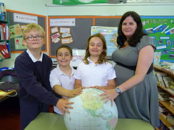 Laurene with Skipness pupils Joseph, Zac and Heleana. Picture: Moira Kerr.