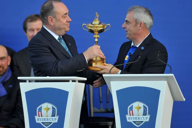 First Minister Alex Salmond presents the trophy to European captain Paul McGinley. Picture: Jane Barlow