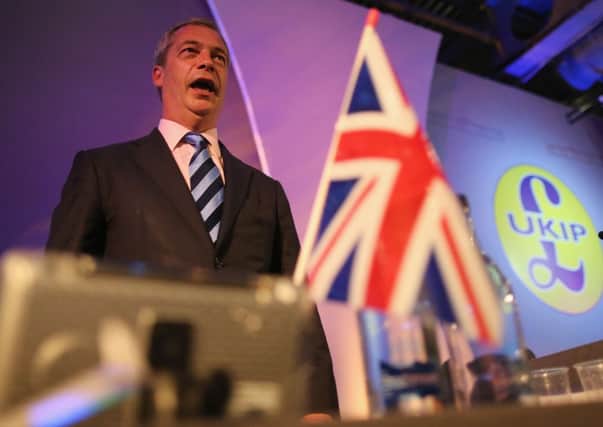 Ukip party leader Nigel Farage sings the national anthem at the end of the party conference. Picture: Getty