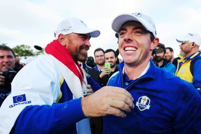 Rory McIlroy celebrates with Thomas Bjorn as Europe savour victory. Picture: Ian Rutherford