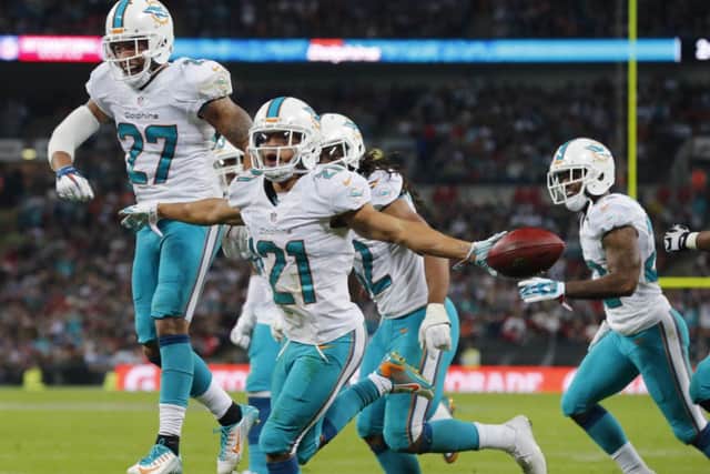 Miami Dolphins Brent Grimes, No 21, celebrates an interception against Oakland Raiders. Picture: Reuters