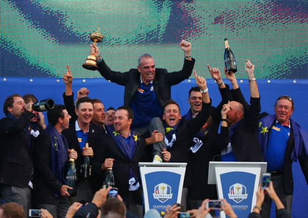 Paul McGinley celebrates winning the Ryder Cup with his team. Picture: Getty