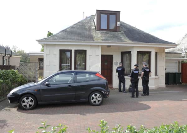 Police outside the house on Crewe Road South where a group of masked men with a weapon broke in an threatened the occupants and demanded cash. Picture: TSPL