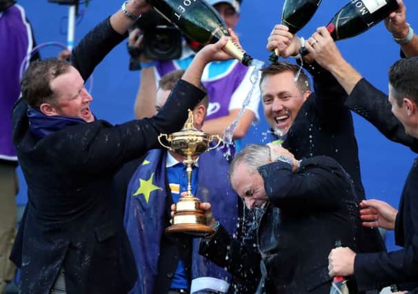 Bucks fizz and quids in for some as the European golf team splash out on winning the cup at Gleneagles. Picture: PA