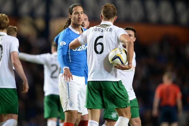 Bilel Mohsni has words with Jordan Forster after Nicky Law's goal. Picture: SNS