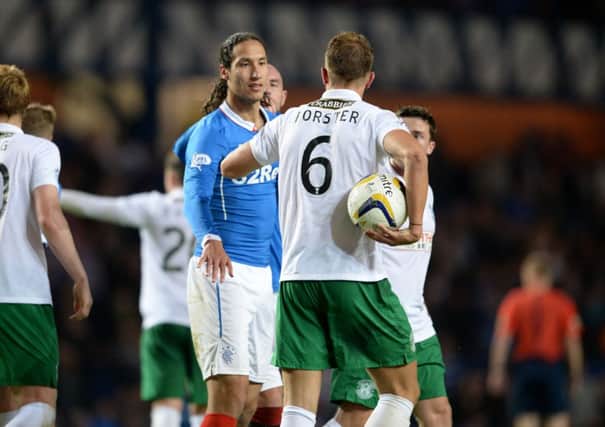 Bilel Mohsni has words with Jordan Forster after Nicky Law's goal. Picture: SNS