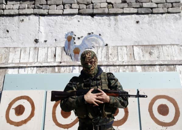 A proRussian at target practice in Donetsk, where 12 people died as fighting went on this week. Picture: AP