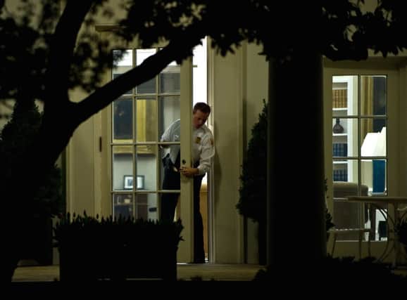 A security guard checks the door to president Obamas Oval Office. Picture: Getty