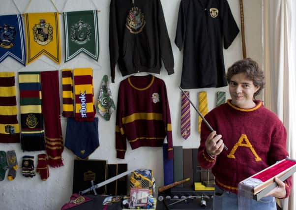 Menahem Asher Silva Vargas, a 37 year old lawyer, shows off his collection of Harry Potter memorabilia. Picture: AP
