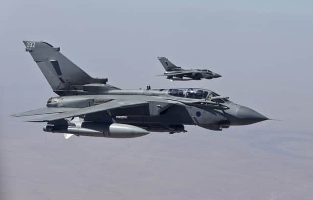 Two RAF Tornado GR4s fly during their first combat missio. Picture: Reuters