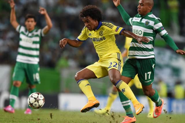 Chelsea's Brazilian midfielder Willian vies with Sporting's Colombian forward Fredy Montero during the UEFA Champions League Group G  match. Picture: Getty