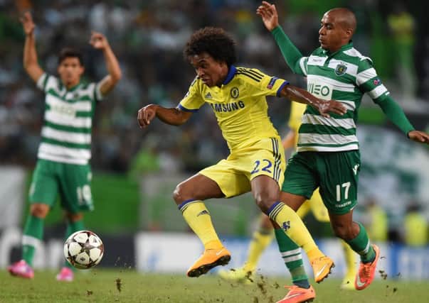 Chelsea's Brazilian midfielder Willian vies with Sporting's Colombian forward Fredy Montero during the UEFA Champions League Group G  match. Picture: Getty
