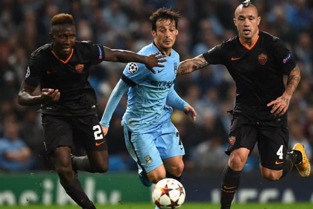 Radja Nainggolan and Mapou Yanga-Mbiwa (L) of AS Roma challenge David Silva of Manchester City. Picture: Getty