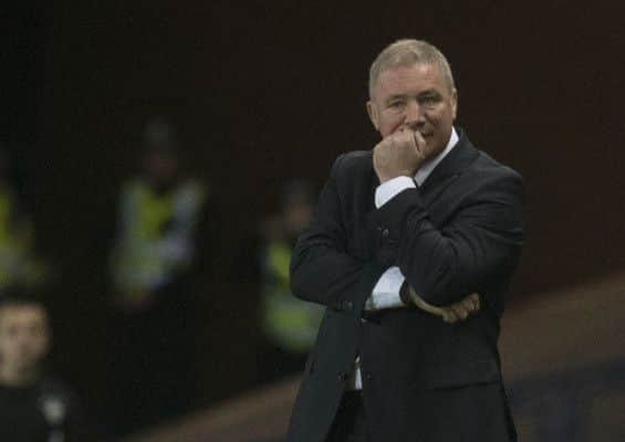 Ally McCoist watches on grimly as Rangers go down 3-1 at home to Hibs. Picture: PA