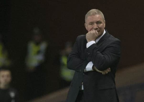 Ally McCoist watches on grimly as Rangers go down 3-1 at home to Hibs. Picture: PA