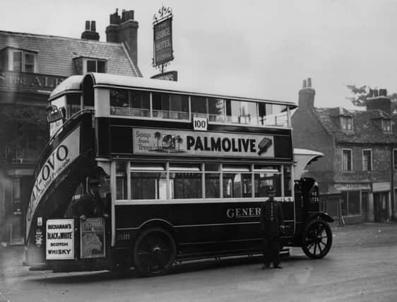 On this day in 1925 the double-deck covered omnibus  complete with advertising  took to the streets of London. Picture: Getty