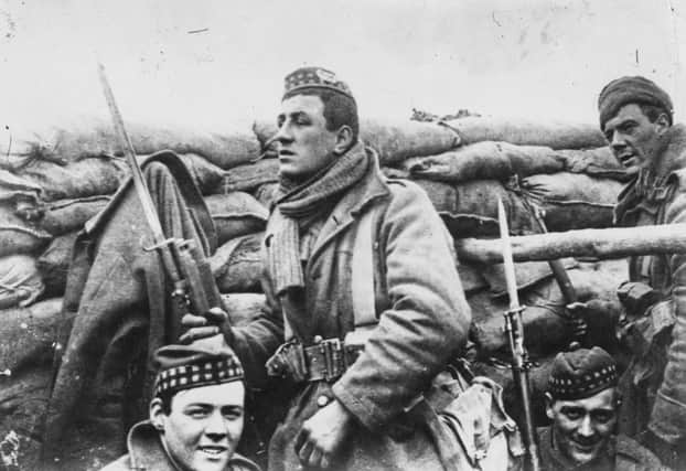 Scottish soldiers with bayonets fixed on the Western Front in 1915 prepare to go over the top. Picture: Getty