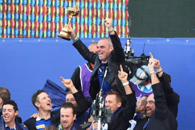 European captain Paul McGinley is held aloft by his players on the stage after the Trophy presentation.  Picture: Ian Rutherford