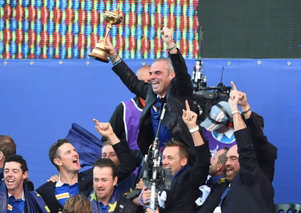 European captain Paul McGinley is held aloft by his players on the stage after the Trophy presentation.  Picture: Ian Rutherford