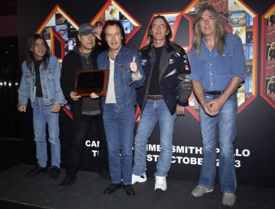 Malcolm Young, Brian Johnson, Angus Young, Phil Rudd and Cliff Williams, pictured in 2003. Picture: PA