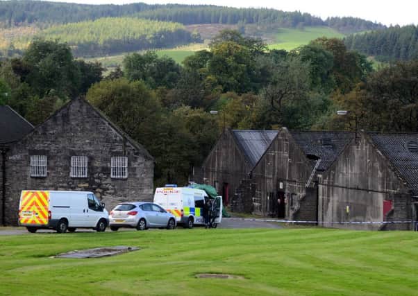 Police on the scene at Parkmore Distillery in Dufftown where a man has died after falling through the roof. Picture: Hemedia