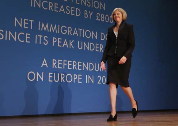 Home Secretary Theresa May walks on to the stage to  address the Conservative party conference. Picture: Getty