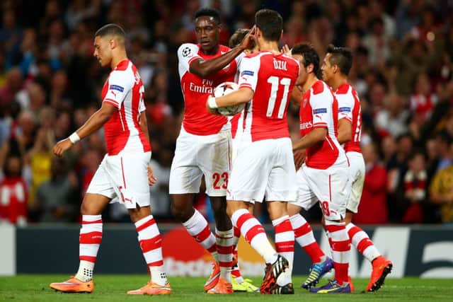 Danny Welbeck of Arsenal celebrates with team-mates after scoring the opening goal. Picture: Getty