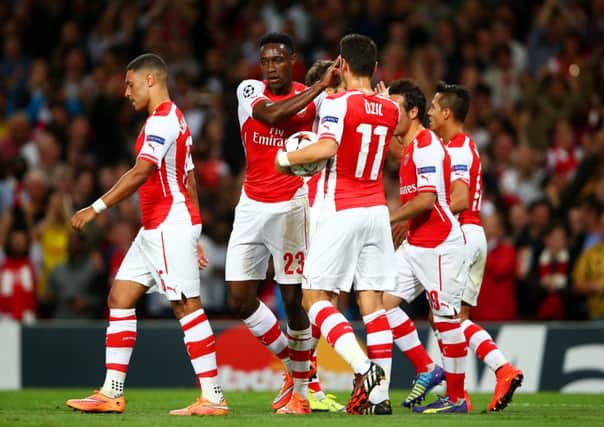 Danny Welbeck of Arsenal celebrates with team-mates after scoring the opening goal. Picture: Getty