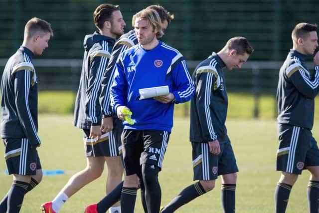 Robbie Neilson has spent the week preparing his players to play on artificial pitches both this weekend and next. Picture: SNS