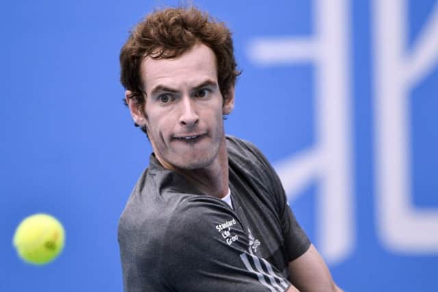 Andy Murray returns a shot during his victory over Marin Cilic. Picture: Getty