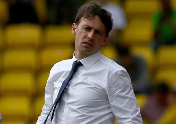 Dougie Freedman feels the strain during Bolton's match at Watford in August. Picture: Getty