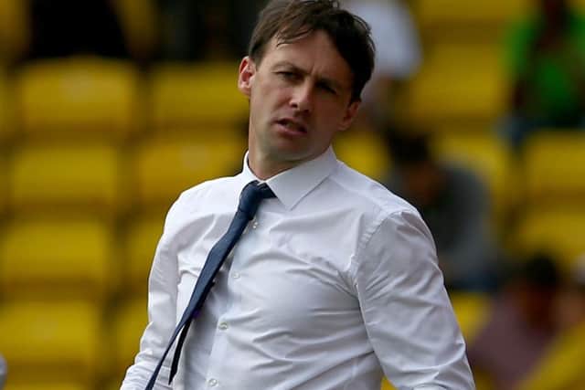Dougie Freedman feels the strain during Bolton's match at Watford in August. Picture: Getty