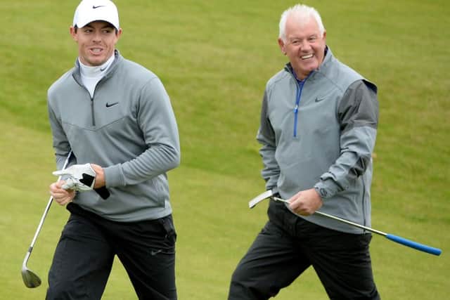 Rory McIlroy with his playing partner and father Gerry McIlroy on the 10th hole at Kingsbarns. Picture: Getty