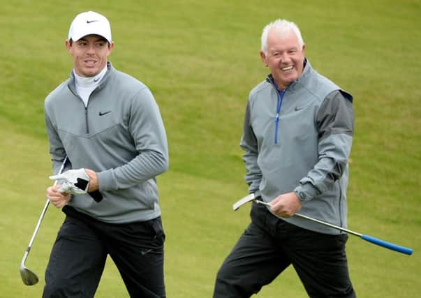 Rory McIlroy with his playing partner and father Gerry McIlroy on the 10th hole at Kingsbarns. Picture: Getty