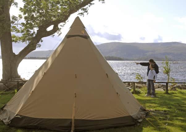 Charles Rutherford and his son Rory (9) enjoying Loch Lomond's shore in the legitimate site, Milarrochy Bay Camping and Caravanning. Picture: Dan Phillips
