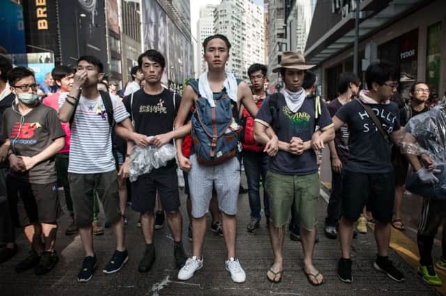 Prodemocracy activists form a defensive line on the streets of Hong Kong. Picture: Getty