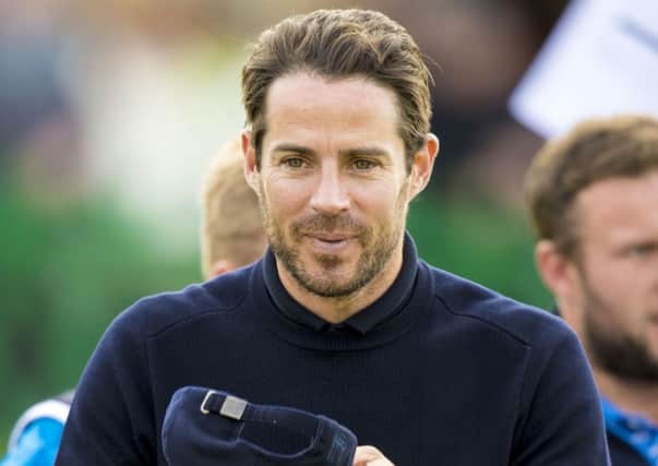 All smiles for former Liverpool footballer Jamie Redknapp as he takes to the St Andrews course. Picture: SNS