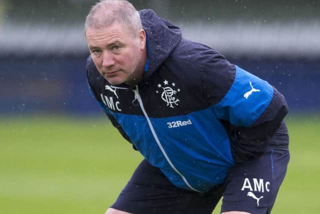 Rangers manager Ally McCoist stretches off during training. Picture: SNS