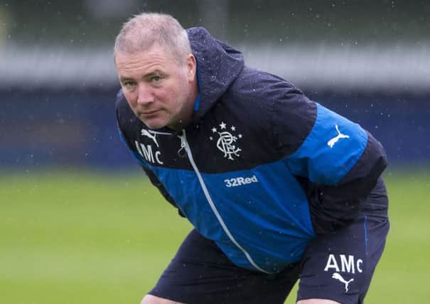 Rangers manager Ally McCoist stretches off during training. Picture: SNS