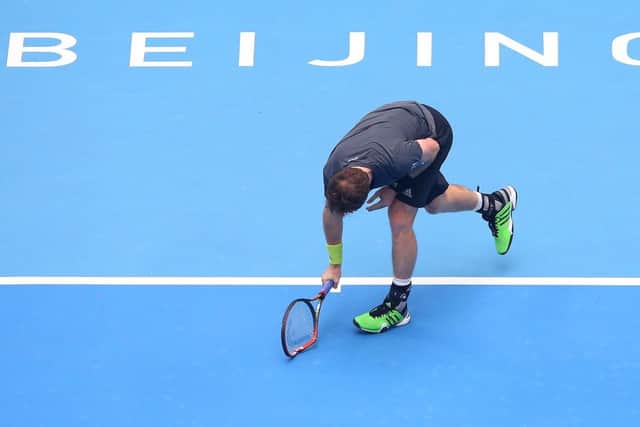 Whoops: Andy Murray smashes his racket in the match against Novak Djokovic at the China Open. Picture: Chris Hyde/Getty Images