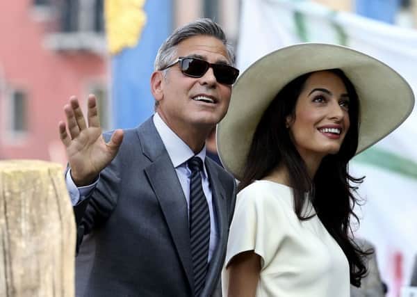 The overblown nature of George Clooneys wedding to Amal Alamuddin in Venice jars with his efforts to be taken seriously as a selfless campaigner for human rights. Picture: Reuters