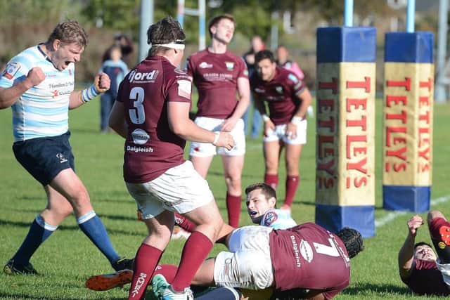 Ruairidh Young, right, scores one of his three tries for Edinburgh Accies, but the Maroons snatched the win late on. Picture: Neil Hanna