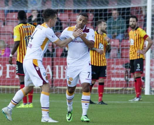 Motherwell's Lionel Ainsworth  celebrates with team-mate Stuart Carswell after scoring. Picture: SNS