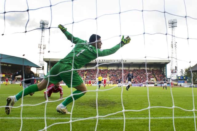 Dundee goalkeeper Kyle Letheren fails to stop the ball hitting the back of the net. Picture: SNS