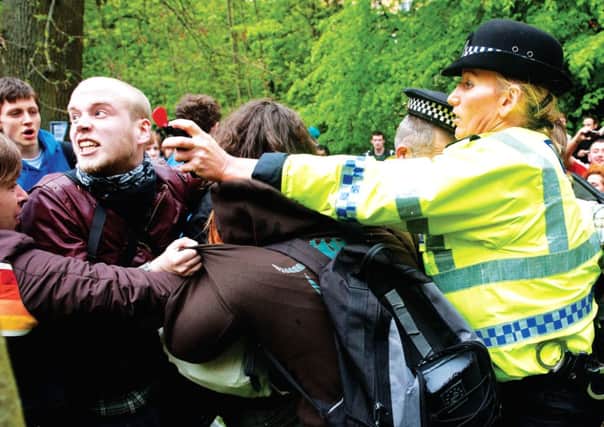A man is sprayed in the face during a 2011 street party in Kelvingrove Park, Glasgow. Photograph: Wattie Cheung